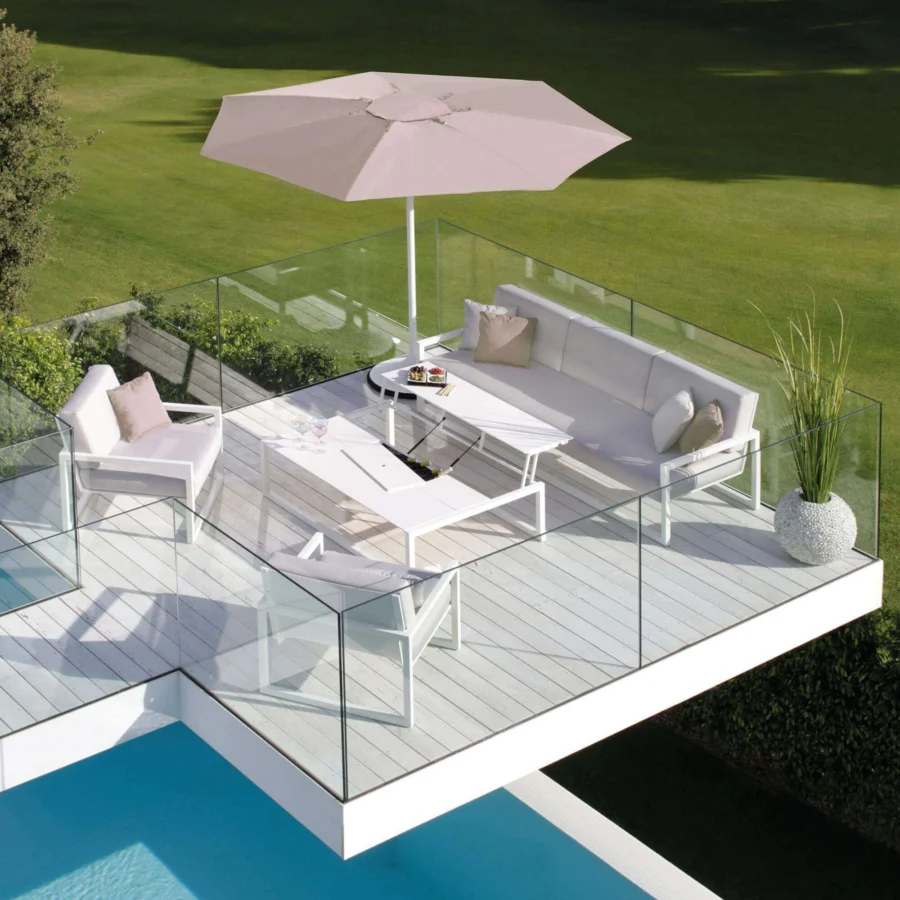 Superior Royal Botania Ninix lounge sofa with white fabric, Batyline seat and stainless steel frame, accented with beige pillows