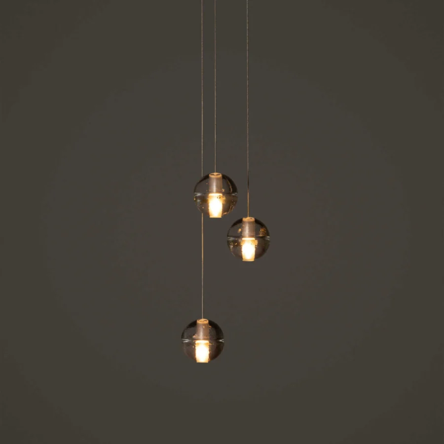 Exclusive Bocci 14 Random suspension lamp with articulated cast glass sphere in translucent amber and frosted cylindrical void