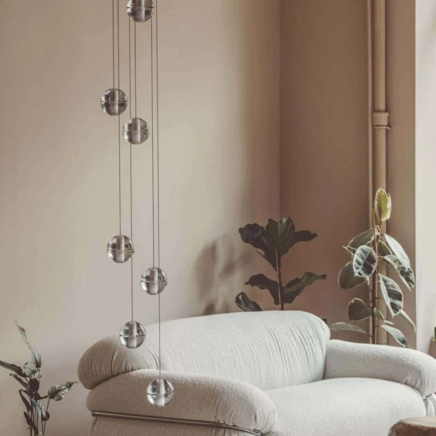 Elegant Bocci 14 Random suspension lamp with articulated cast glass spheres and polished silver finish