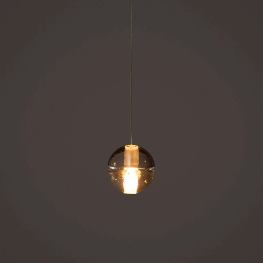 Superior Bocci 14 Single Pendant suspension lamp with amber cast glass and frosted cylindrical void built with a dark neutral cable