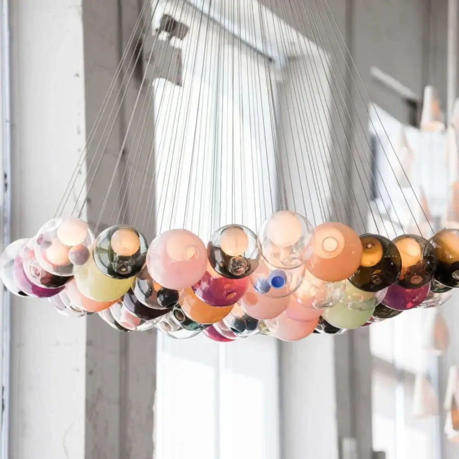 Captivating Bocci 28 Cluster suspension lamp with clustered clear glass and milk white interior holders in pale pink, amber, and silver-toned cables