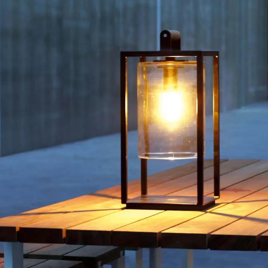 Distinguished Royal Botania Dome Small Table Lamp with black powder-coated aluminum frame and clear glass cylinder showcasing a warm glow