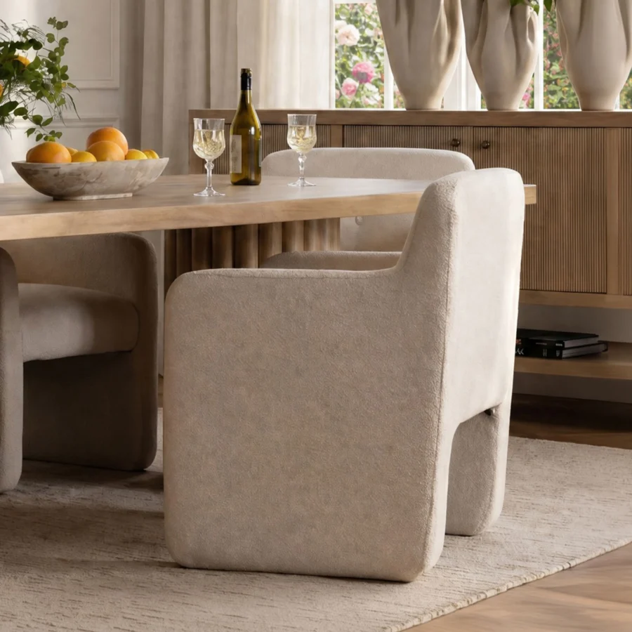 Armchair by Dovetail in off-white polyester performance fabric with matte finish, button-tufted back and integrated arms
