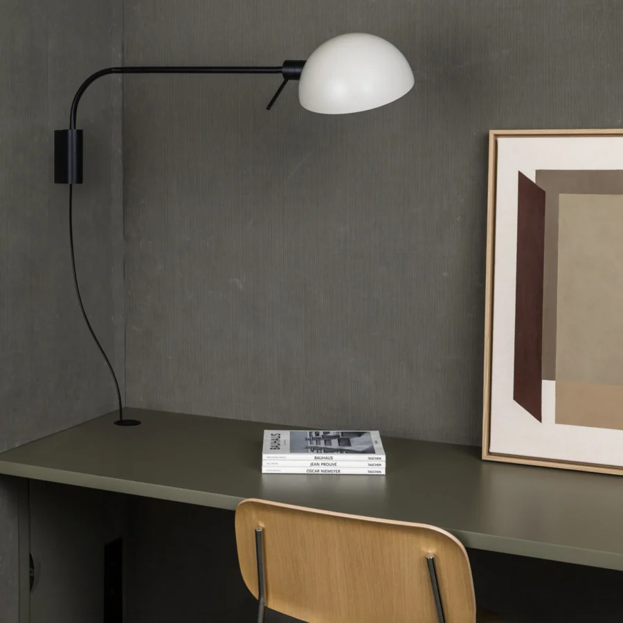 Wall lamp by Faro Barcelona with matte black steel structure and white metal shade, showing articulated tubular arm