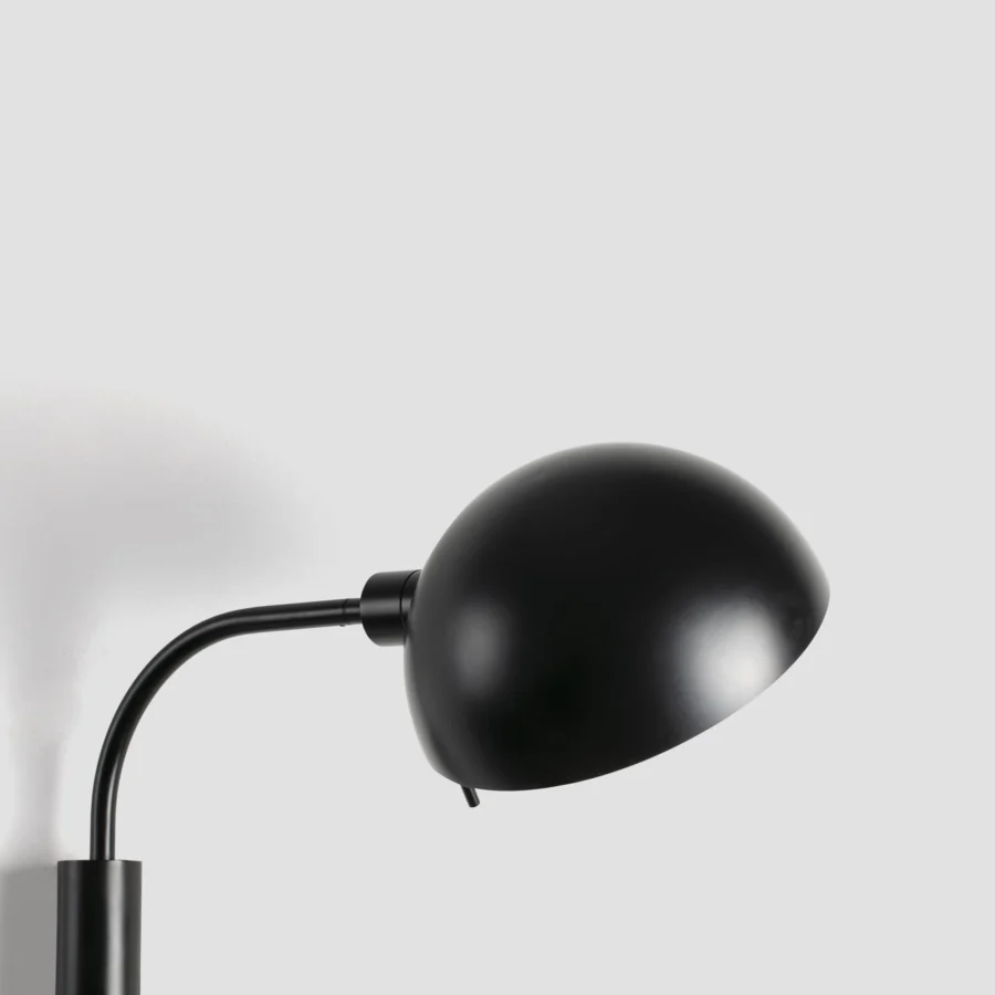 Wall lamp by Faro Barcelona in steel with matte black finish, featuring articulated construction and hemispherical shade
