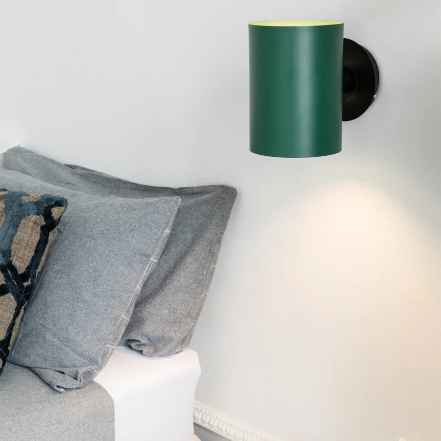 Wall lamp by Faro Barcelona in steel with matte dark green finish and lime interior, attached to a black round…