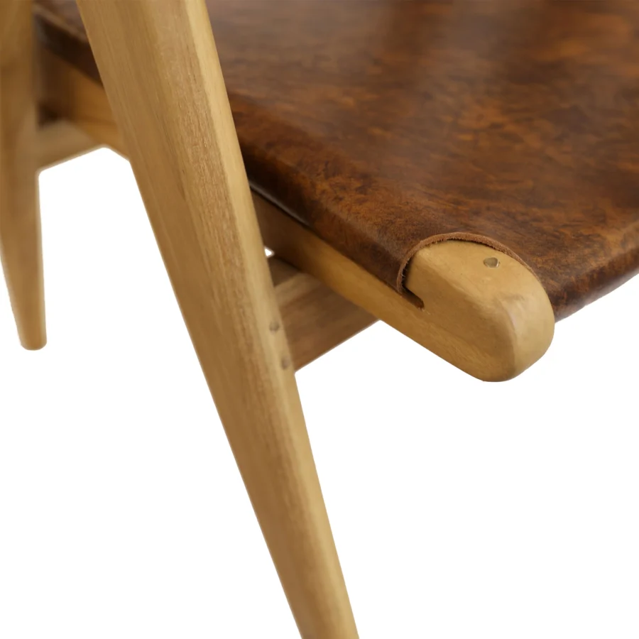 Armchair by Dovetail Oaklynn featuring antique brown leather seat on teak wood frame with matte finish