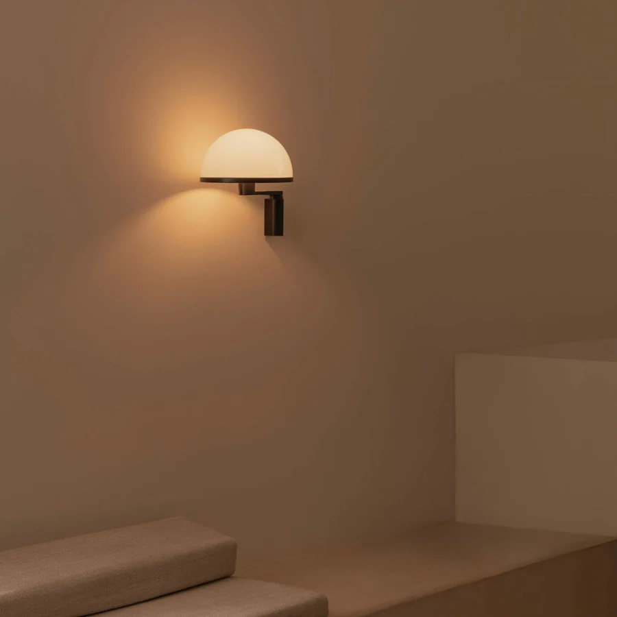 Wall lamp by Faro Barcelona with matte black metal frame and translucent opaline diffuser in hemispherical geometry
