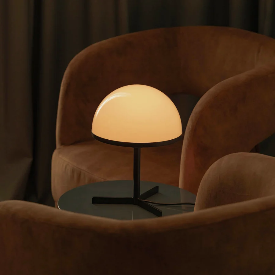 Table lamp by Faro Barcelona with translucent white opaline glass dome shade, slender matte black metal stem, three legs