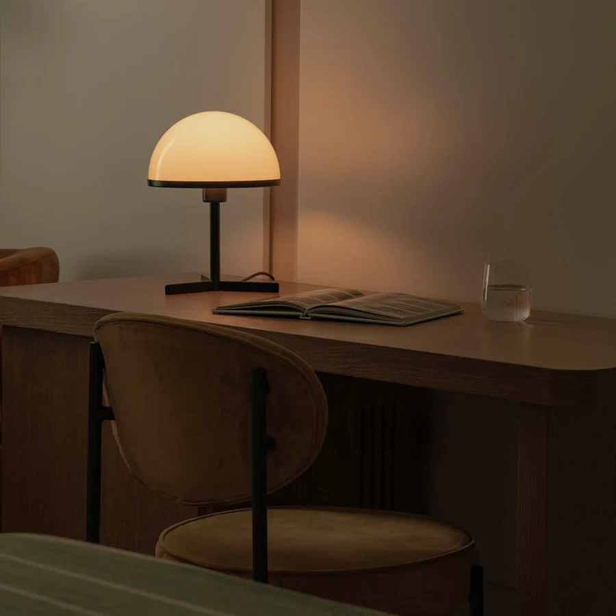 Table lamp by Faro Barcelona with opaline diffuser shade in semi-gloss finish atop matte black metal stem, crossed base