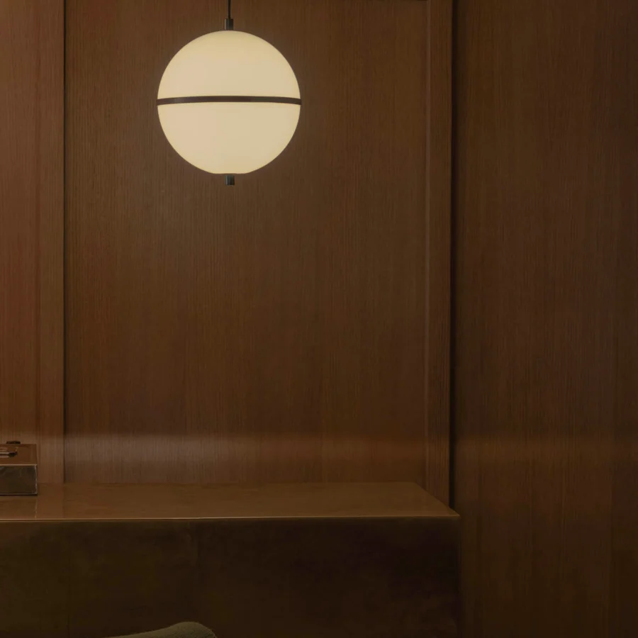 Suspension lamp by Faro Barcelona in opaline glass with matte finish, featuring two hemispheres and dark metal band