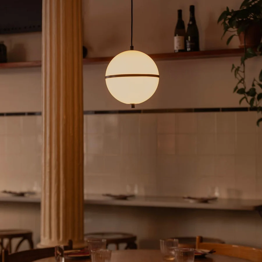 Suspension lamp by Faro Barcelona in spherical glass with matte white finish and dark horizontal band on a black cord