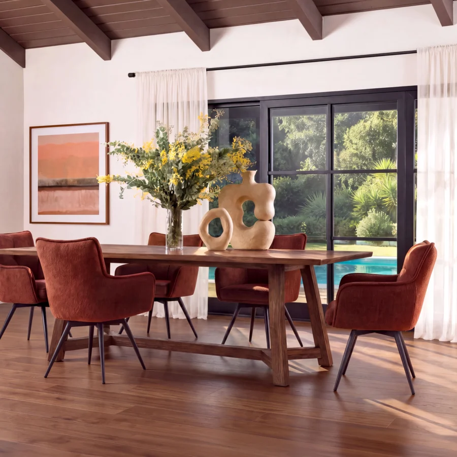 Dining armchair by Dovetail in burgundy chenille upholstery and black steel legs with a swivel function, tufted backrest