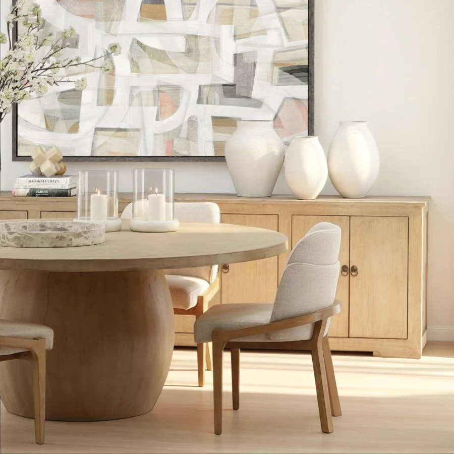 Round dining table by Dovetail Belize crafted from reclaimed pine wood featuring a light warm wash finish and spherical pedestal…