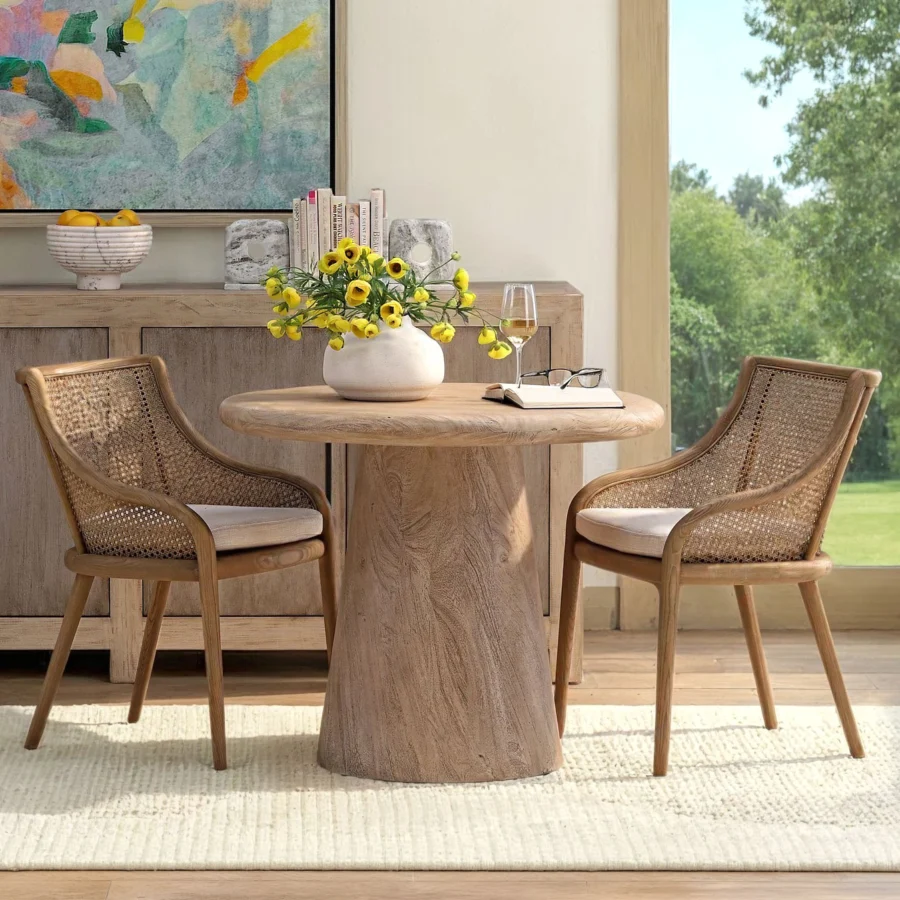 Bistro table by Dovetail crafted from weathered natural acacia wood with a matte finish and light tan flared pedestal base