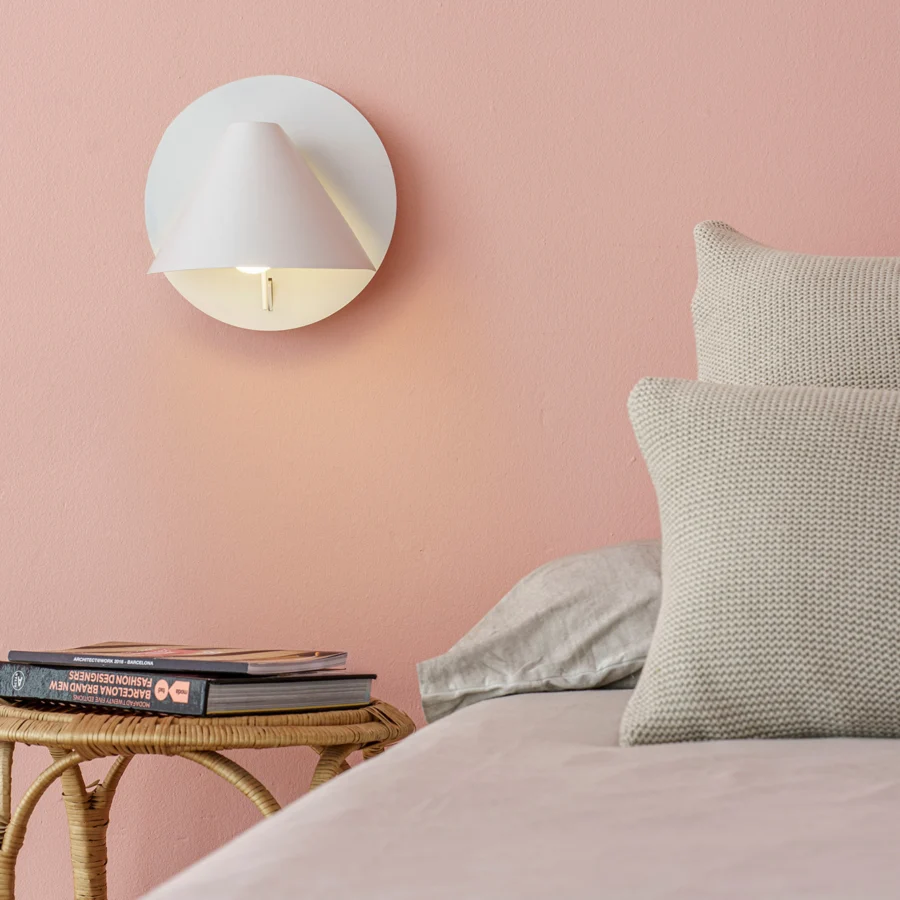 Wall lamp by Faro Barcelona in white matte metal with articulated cone shaped shade mounted to a circular backplate