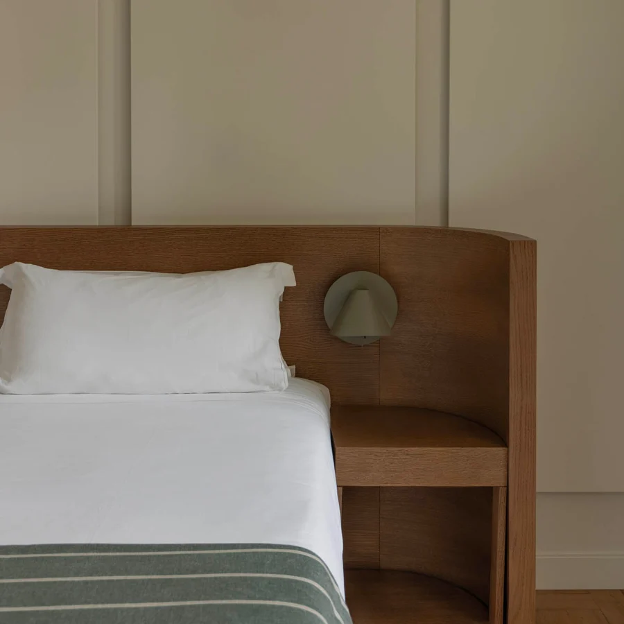 Wall lamp by Faro Barcelona in metal with a matte greige finish, featuring an articulated conical shape and backplate