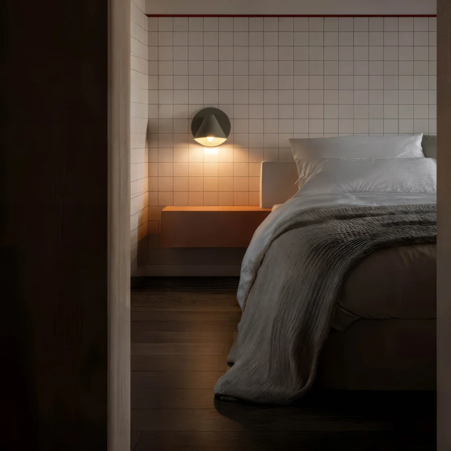 Wall lamp by Faro Barcelona in metal with dark grey matte finish, cone shade, and circular base plate