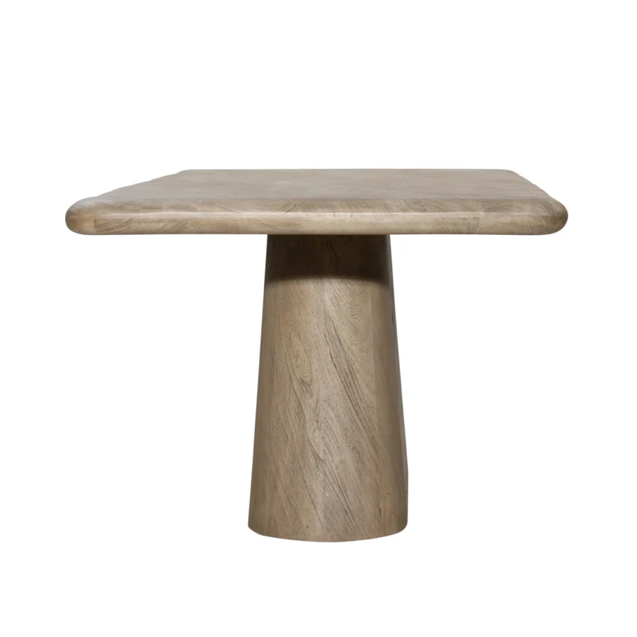 Dining table by Dovetail in solid acacia wood with a weathered natural finish, featuring thick rounded corners and pedestal