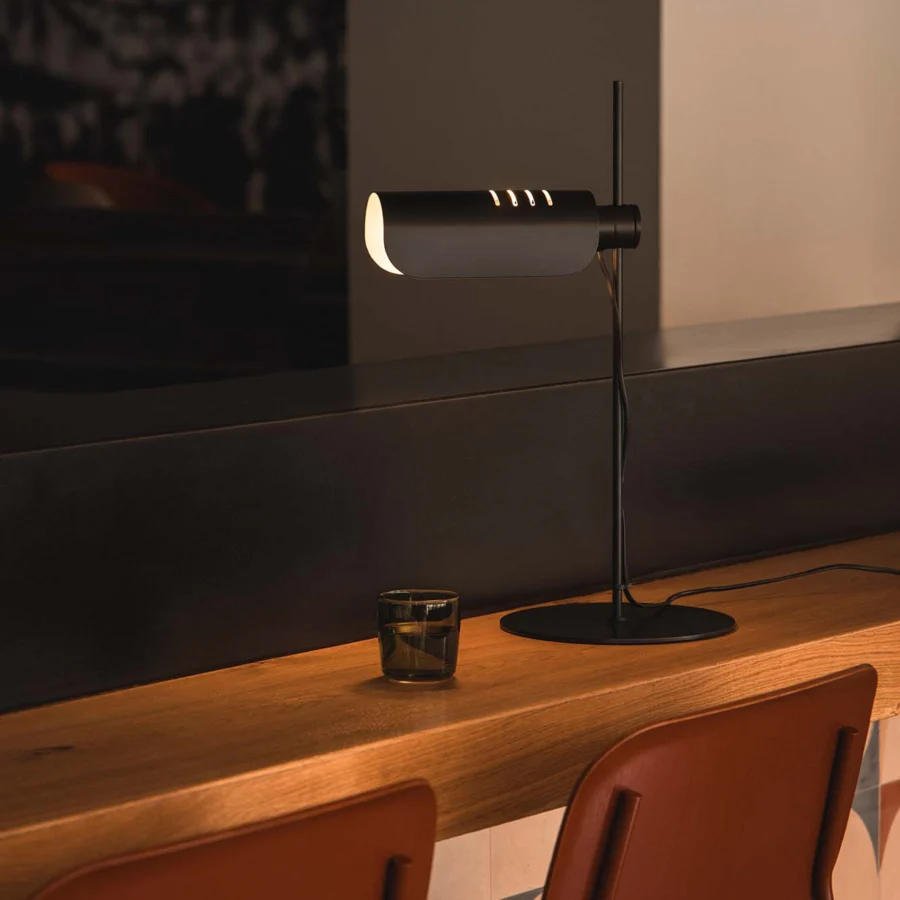 Table lamp by Faro Barcelona in matte black metal with cylindrical slatted shade, vertical stem and flat circular base