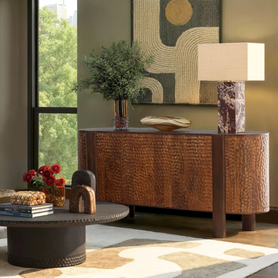 Sideboard by Dovetail in mango wood featuring a brown finish and three rounded cabinet doors with a textured pattern