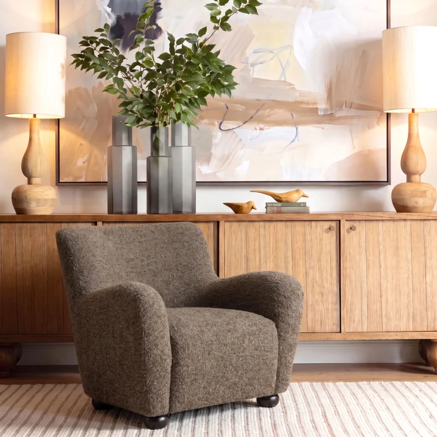 Lounge chair by Dovetail Zulia in heathered medium brown bouclé fabric with integrated armrests and dark rounded bun feet