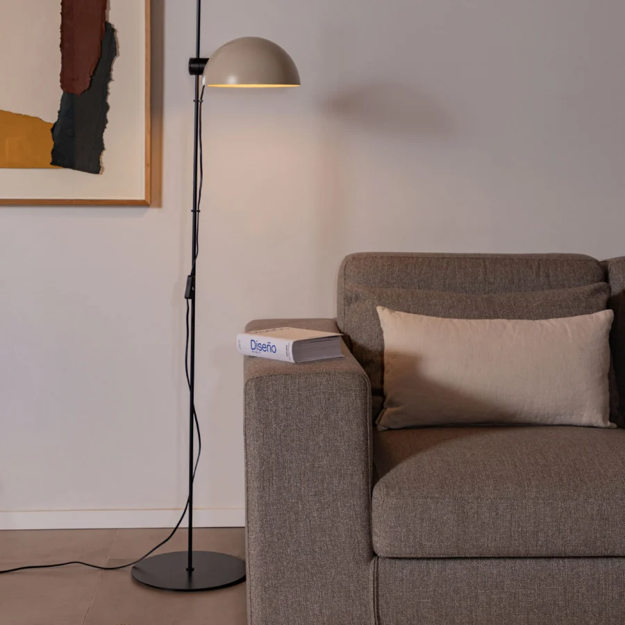 Floor lamp by Faro Barcelona in black metal featuring a beige dome shade plus circular base alongside an adjustable arm…