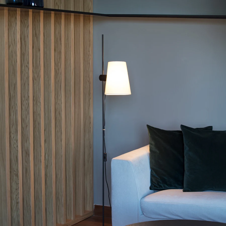 Floor lamp by Faro Barcelona with metal frame, matte black finish, and off-white fabric shade