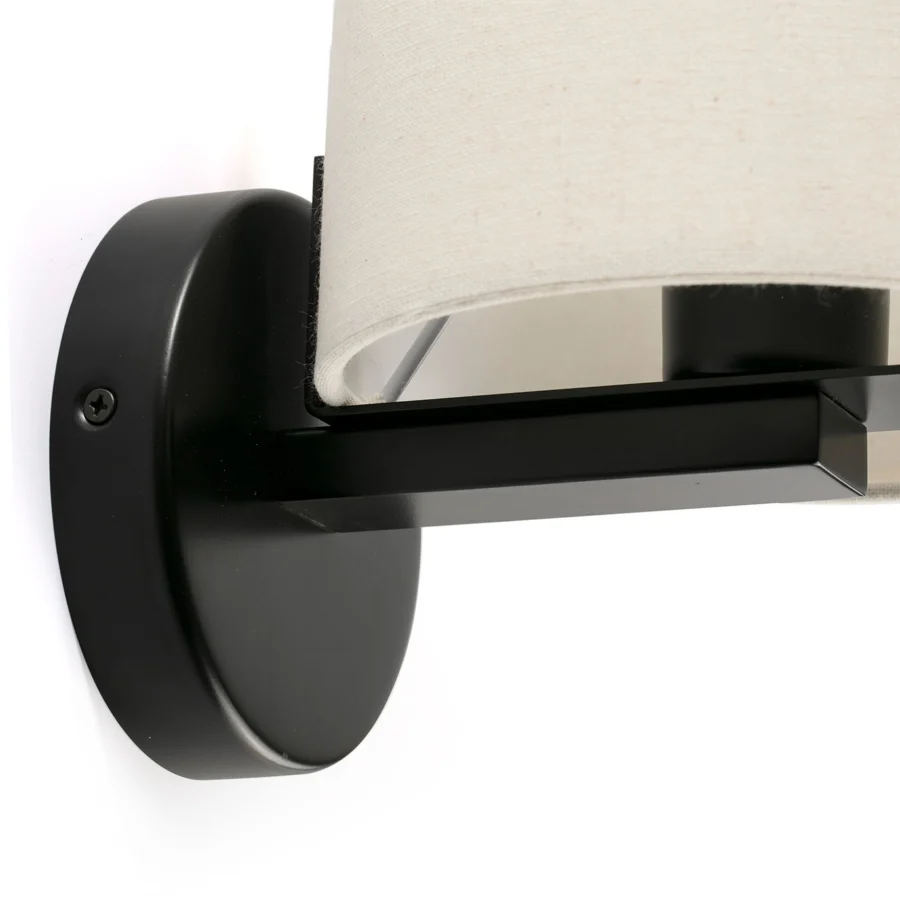 Wall lamp by Faro Barcelona, featuring a cylindrical off-white fabric shade and metal frame in matte black finish