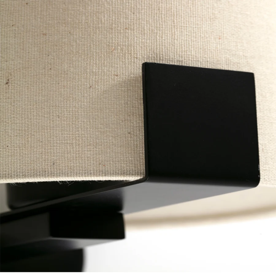 Wall lamp by Faro Barcelona with beige textured fabric shade and matte black metal frame, built as a directional unit