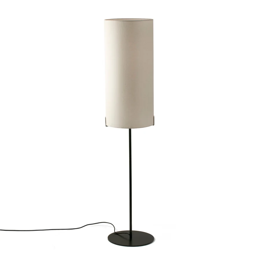 Lamp by Faro Barcelona featuring cylindrical off-white fabric shade on thin black metal stem and circular base