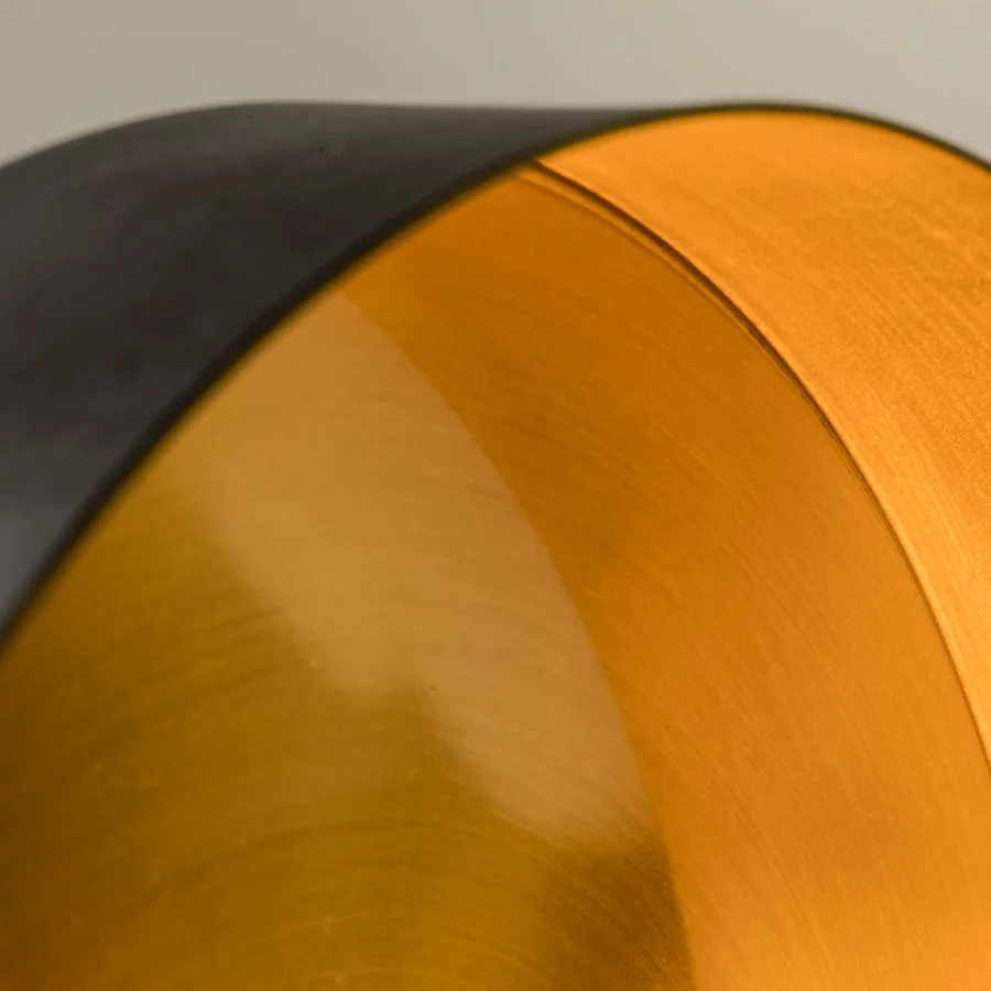 Suspension lamp by Faro Barcelona in dark grey metal with matte exterior, brushed gold interior and recyclable form