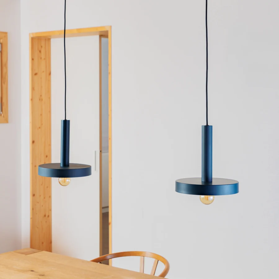 Suspension lamp by Faro Barcelona in dark blue metal with a matte finish, cord, horizontal disc, and exposed bulb