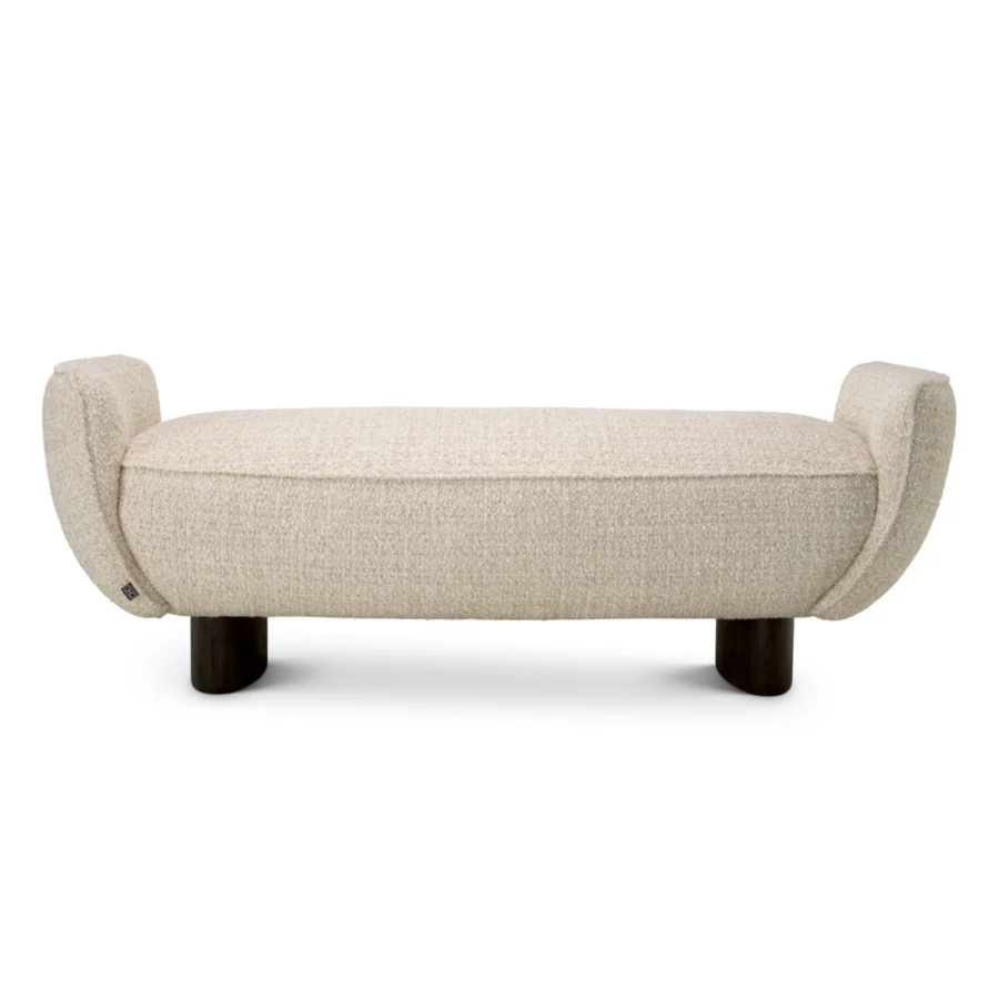 Bench by Eichholtz in off-white bouclé upholstery with integrated bolster ends and dark brown wood legs in matte finish