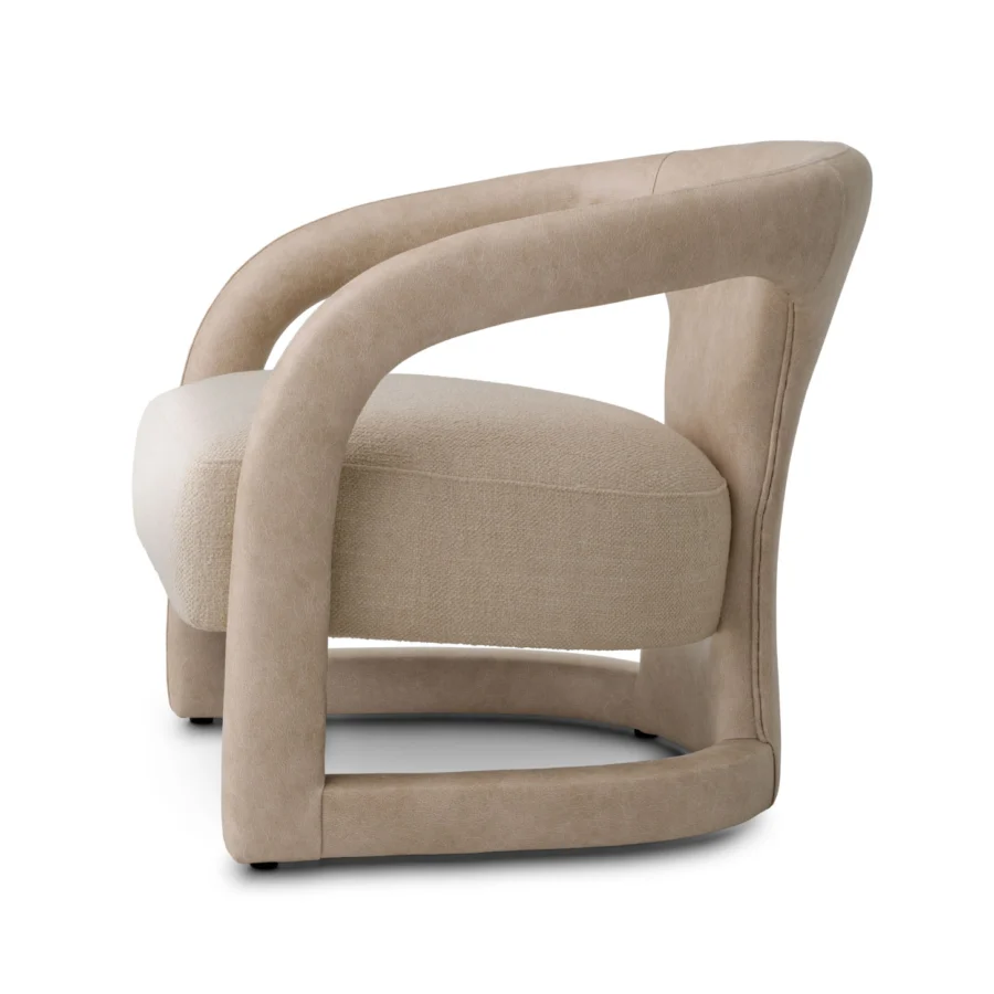 Lounge chair by Eichholtz in Renato ecru fabric and Valente faux leather with C-shaped frame in matte distressed grain