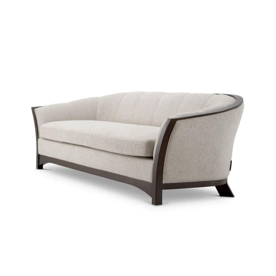 Sofa by Eichholtz Bleecker in Palmer Beige fabric with vertical channel tufting and an exposed dark brown mahogany frame