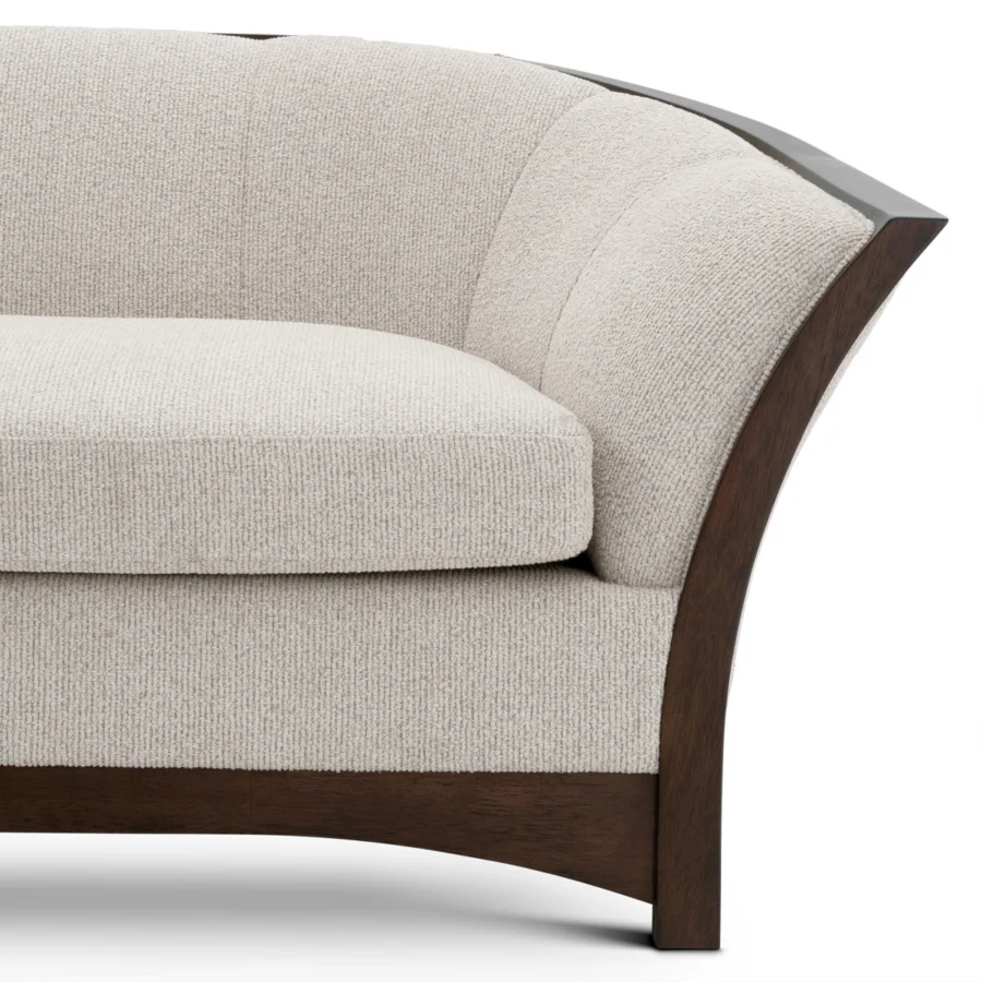 Sofa by Eichholtz in Palmer Beige coarse woven fabric with a dark brown mahogany look wooden base and curved backrest