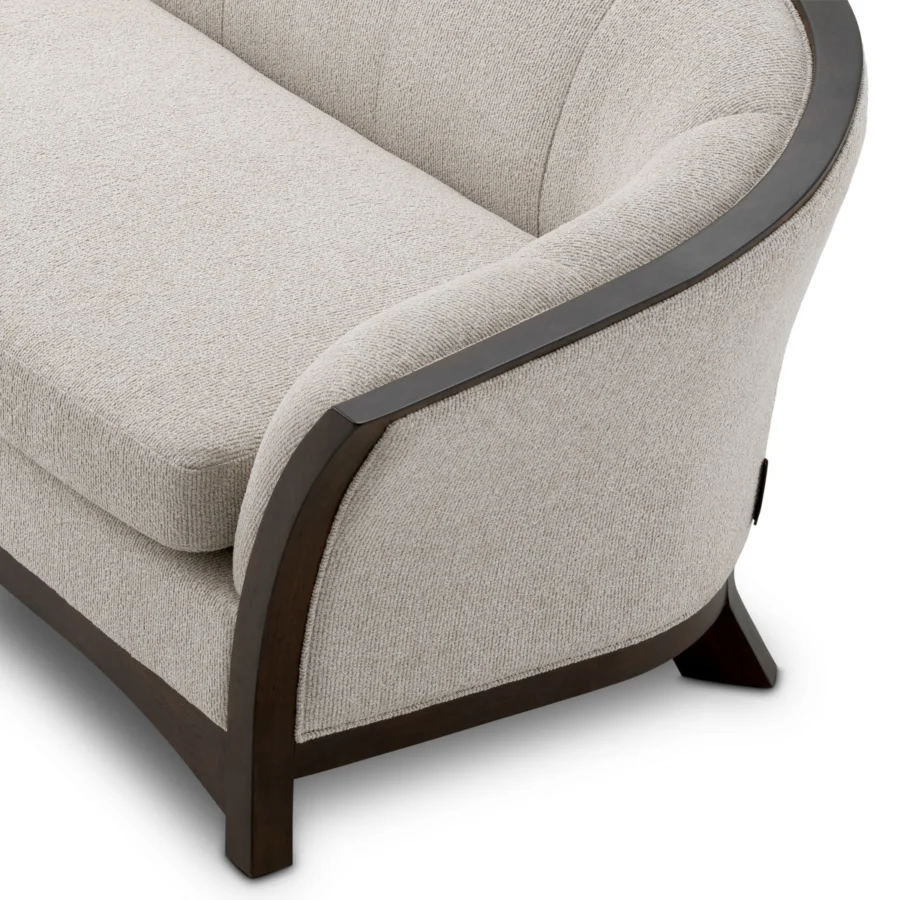 Sofa by Eichholtz in Palmer Beige upholstery with channel-tufted backrest and mahogany frame in smooth satin wood finish