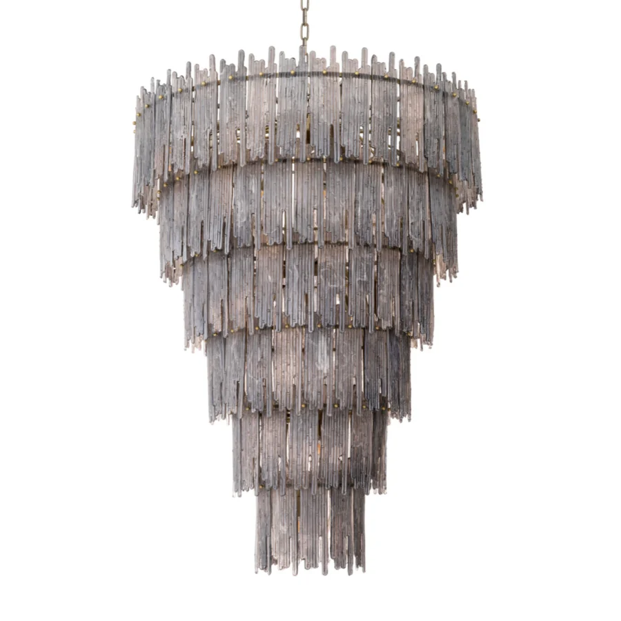 Chandelier by Eichholtz Saint Roch with six cascading tiers of smoked glass elements and a brushed brass finish frame