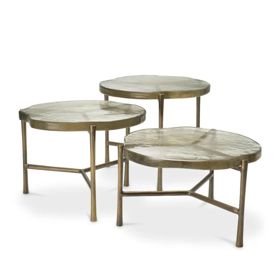 Coffee table set by Eichholtz featuring free form glass tops in yellowish green and vintage brass finish metal base