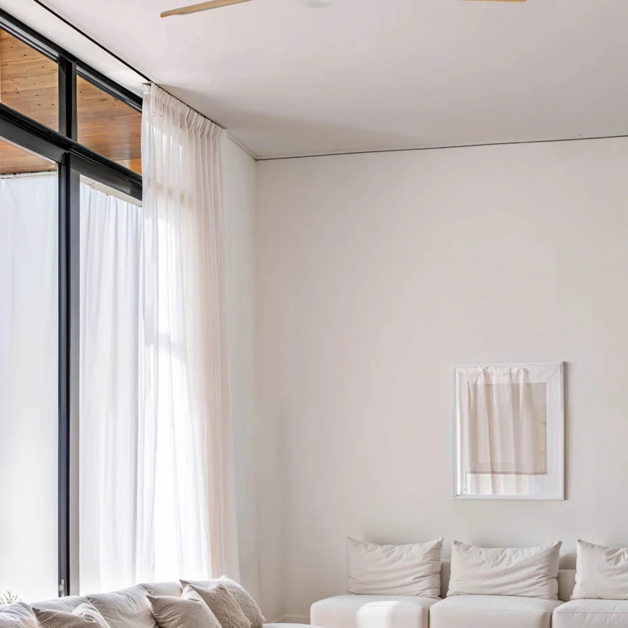 Ceiling fan by Faro Barcelona featuring pine blades in natural wood finish alongside matte white central housing and integrated light