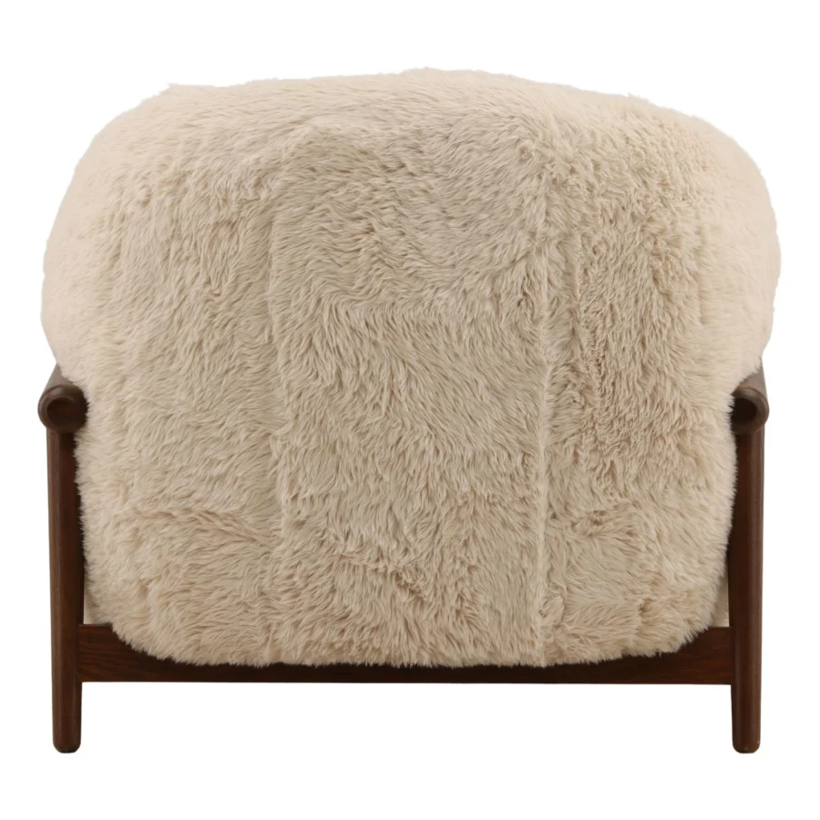Occasional chair by Dovetail in beige faux fur upholstery with a dark brown rubber wood frame and rounded silhouette