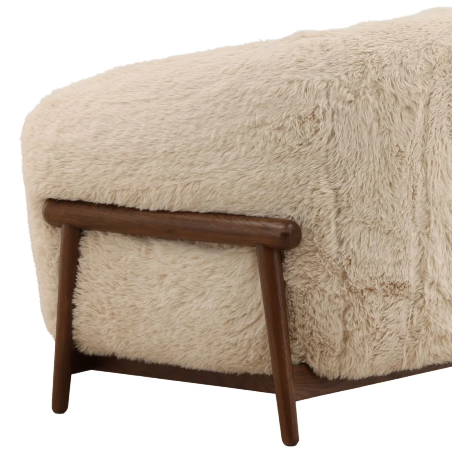 Occasional chair by Dovetail in light cream faux fur upholstery with a dark rubber wood frame