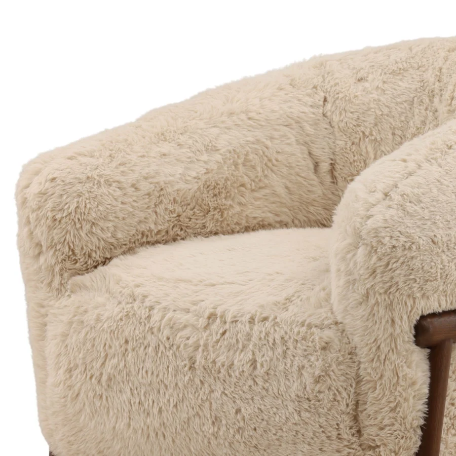 Occasional chair by Dovetail in light beige faux fur upholstery with a dark matte finish on a sturdy rubber wood…