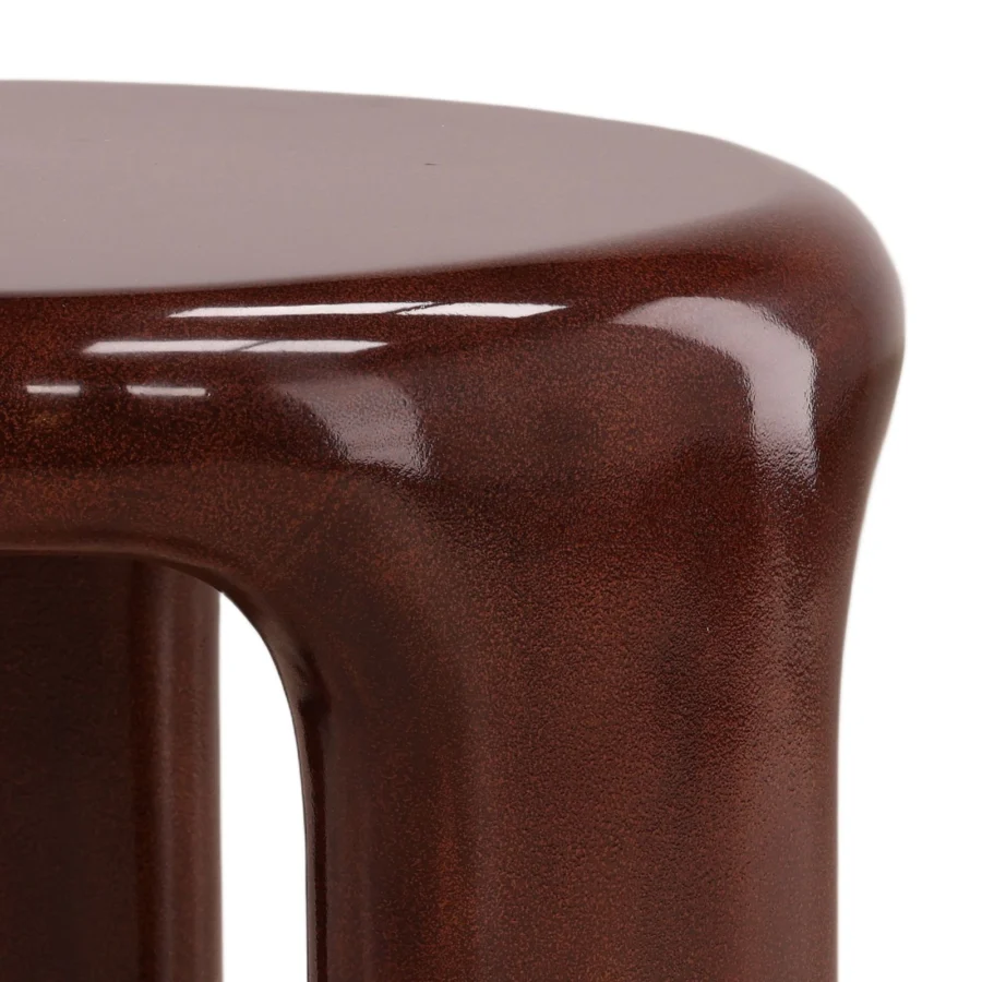 Side table by Dovetail Kevelyn crafted in brown concrete with a monolithic organic silhouette and speckled high-gloss finish