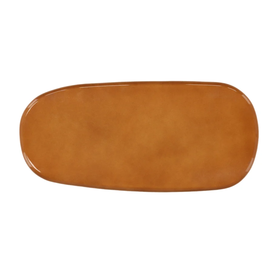 Coffee table by Dovetail Kevelyn in amber concrete with a high-gloss finish, featuring an elongated asymmetrical silhouette