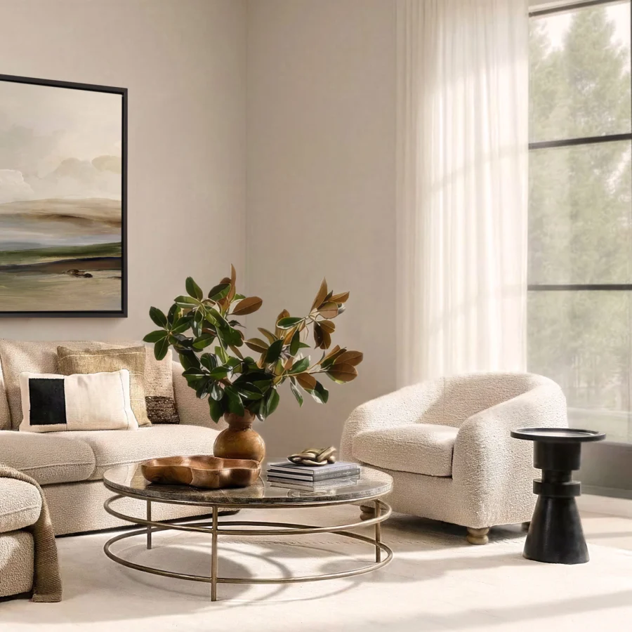 Coffee table by Dovetail featuring a circular marble top in dark grey-brown with natural veining and a brushed gold metal…