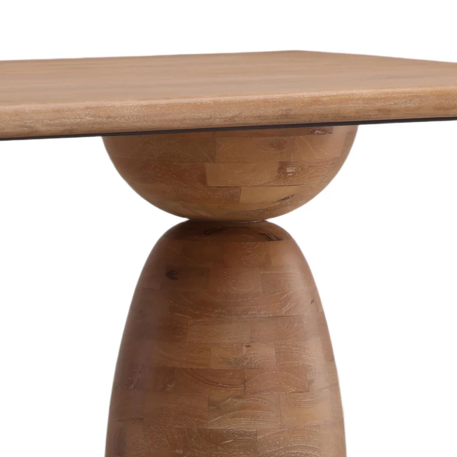 Dining table by Dovetail crafted from mango wood with matte finish, rectangular top and sculptural stacked pedestal base
