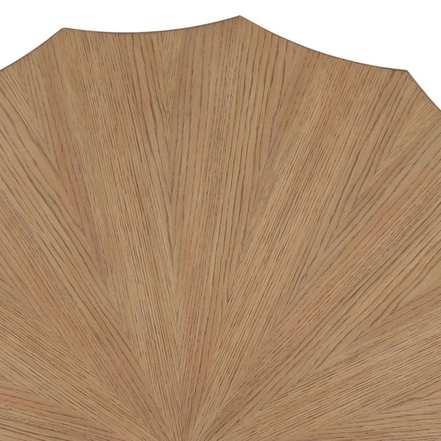 Coffee table by Dovetail in rubber wood and oak veneer with matte finish showing brown sunburst pattern and faceted edges