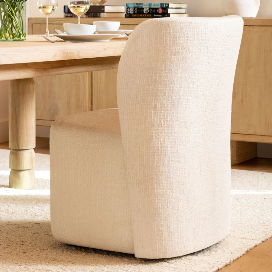 Dining chair by Dovetail Saoirse in light beige cross-hatched fabric with Parsons silhouette and curved backrest frame